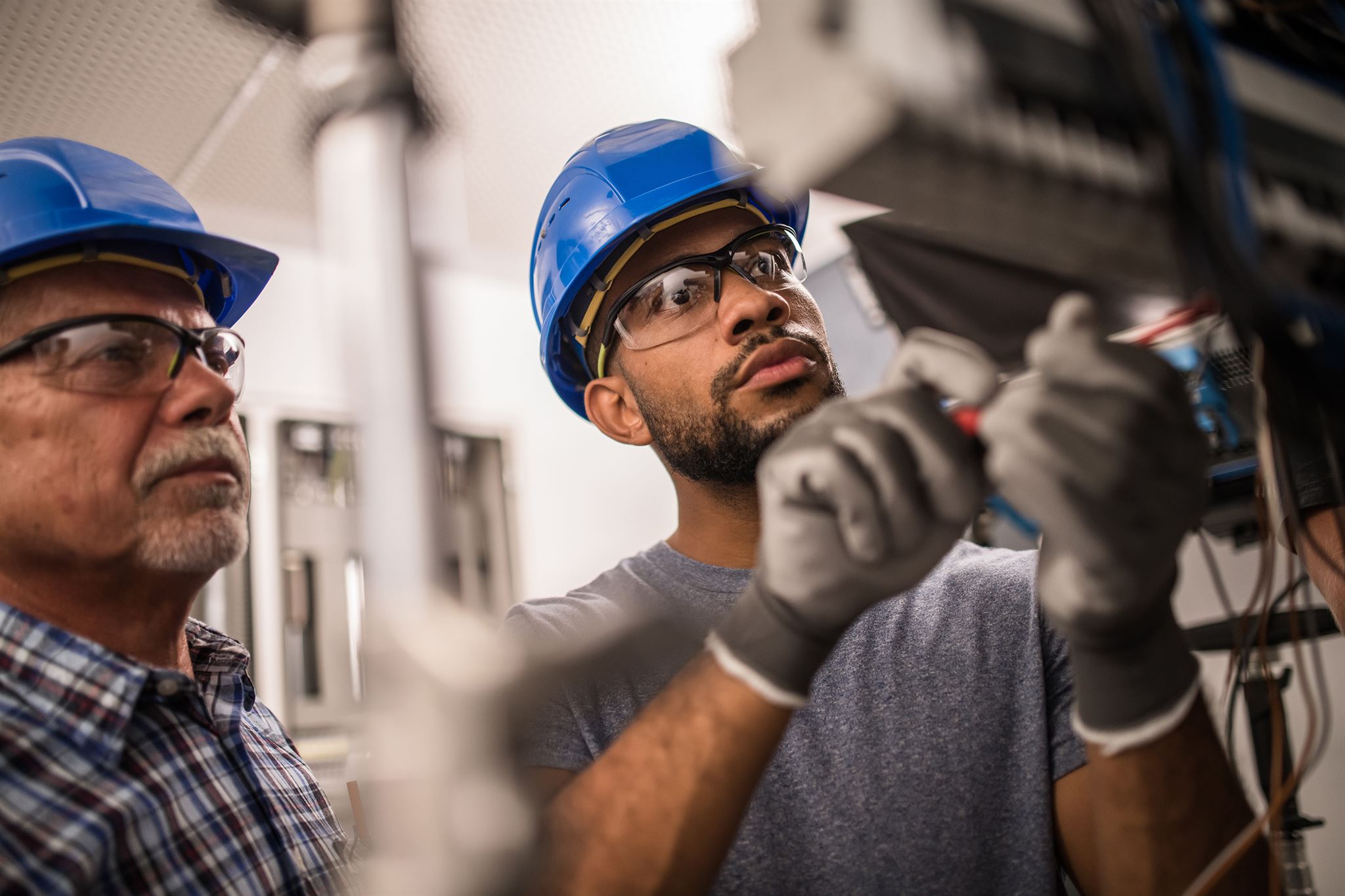 Industrial maintenance training video showing equipment and operators